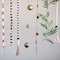 Hello Honey® 6.3ft. Gold Finish Metal Jingle Bell Garland